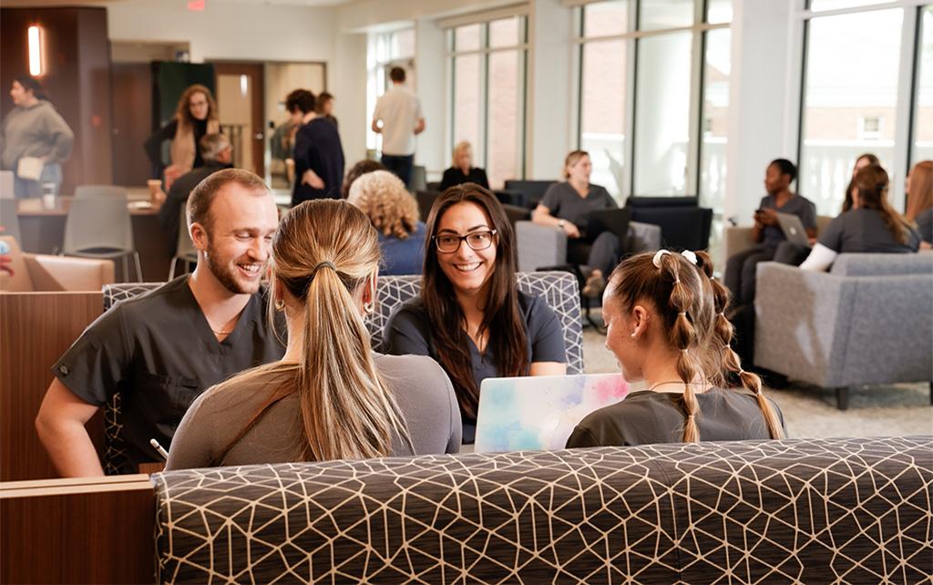 Nursing students in a group talking